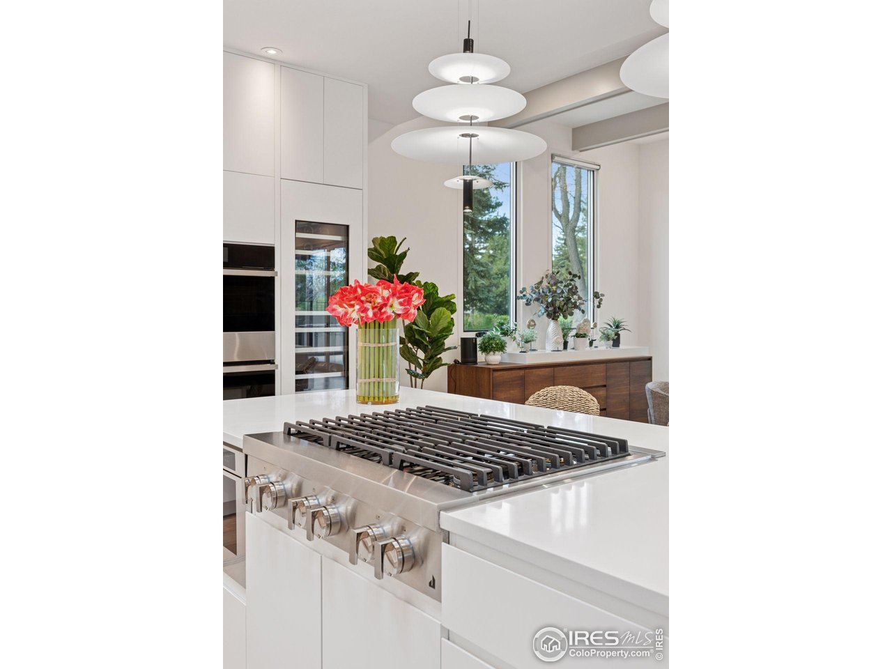 7323 Old Post Road Boulder, CO 80301 - Photo 15 of 40 a kitchen view of a center island table and chairs