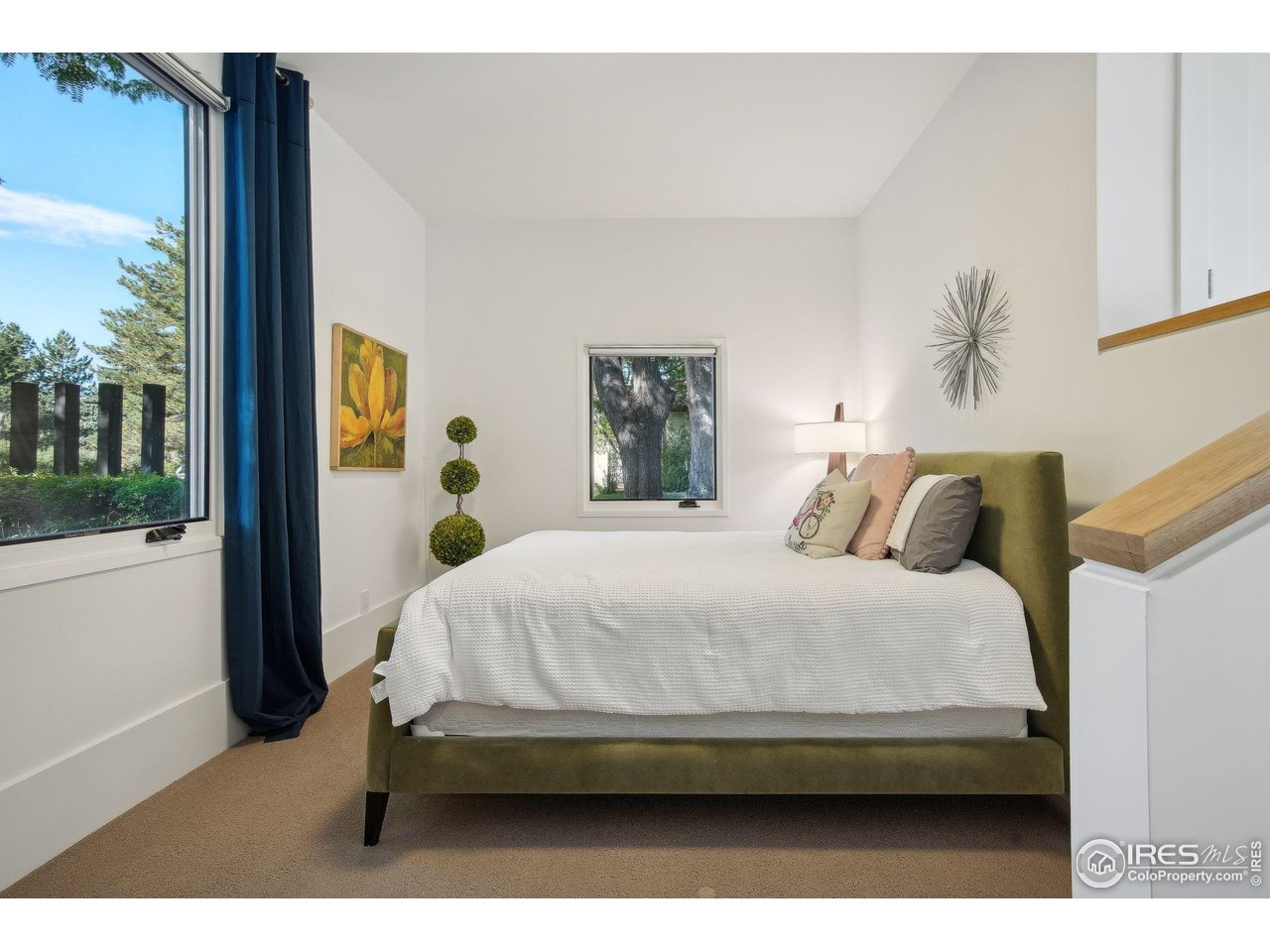 7323 Old Post Road Boulder, CO 80301 - Photo 31 of 40 a bed sitting in a bedroom next to a window