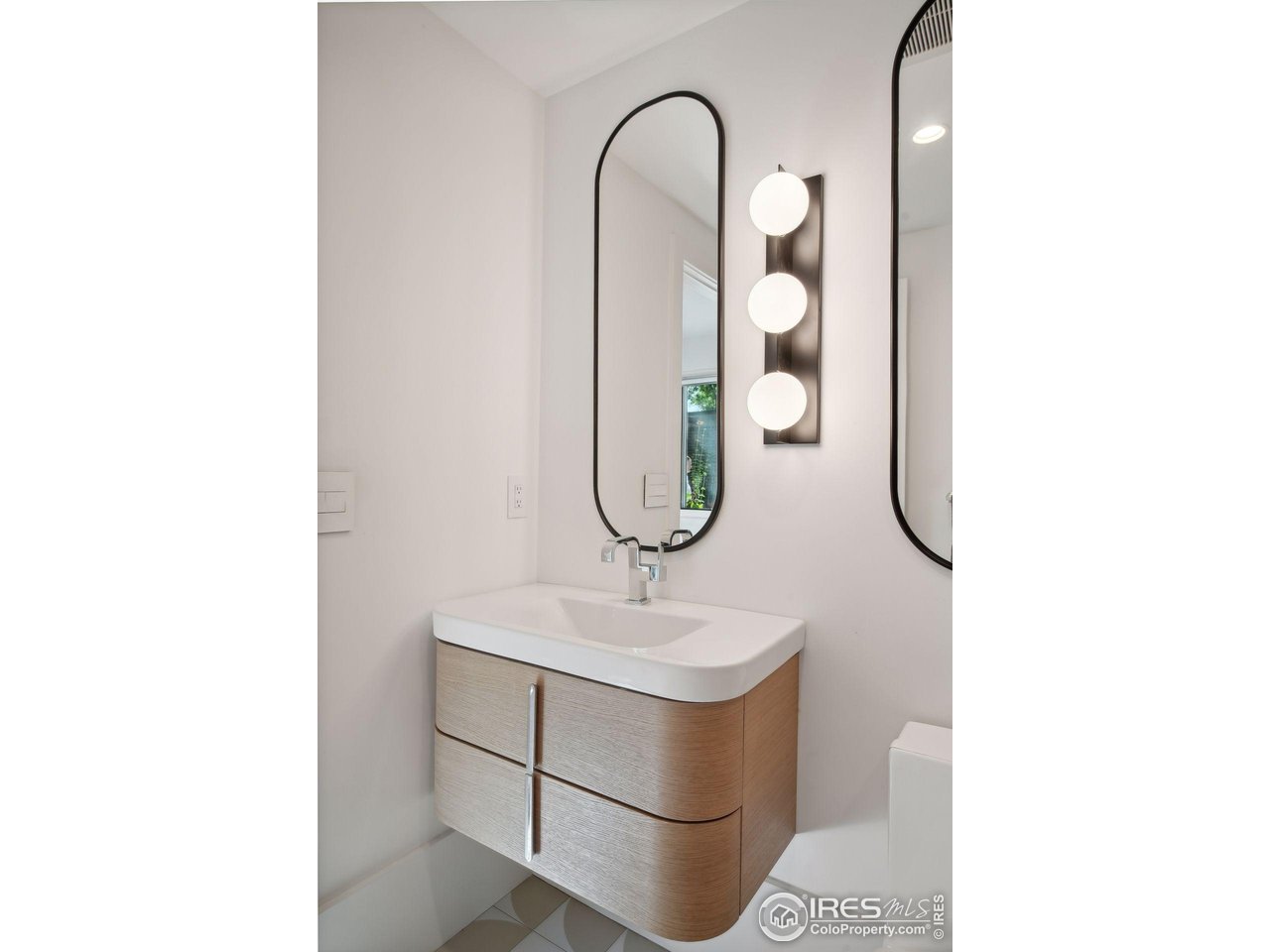 7323 Old Post Road Boulder, CO 80301 - Photo 32 of 40 a bathroom with a sink and mirror