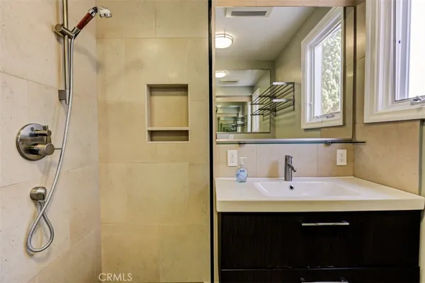 a bathroom with a sink and a mirror