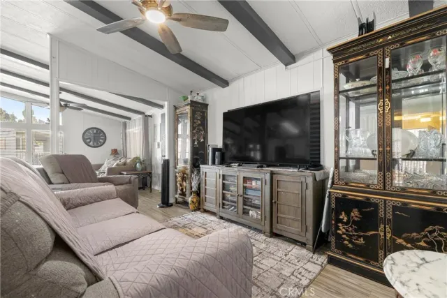 a view of a hallway with workspace and a window