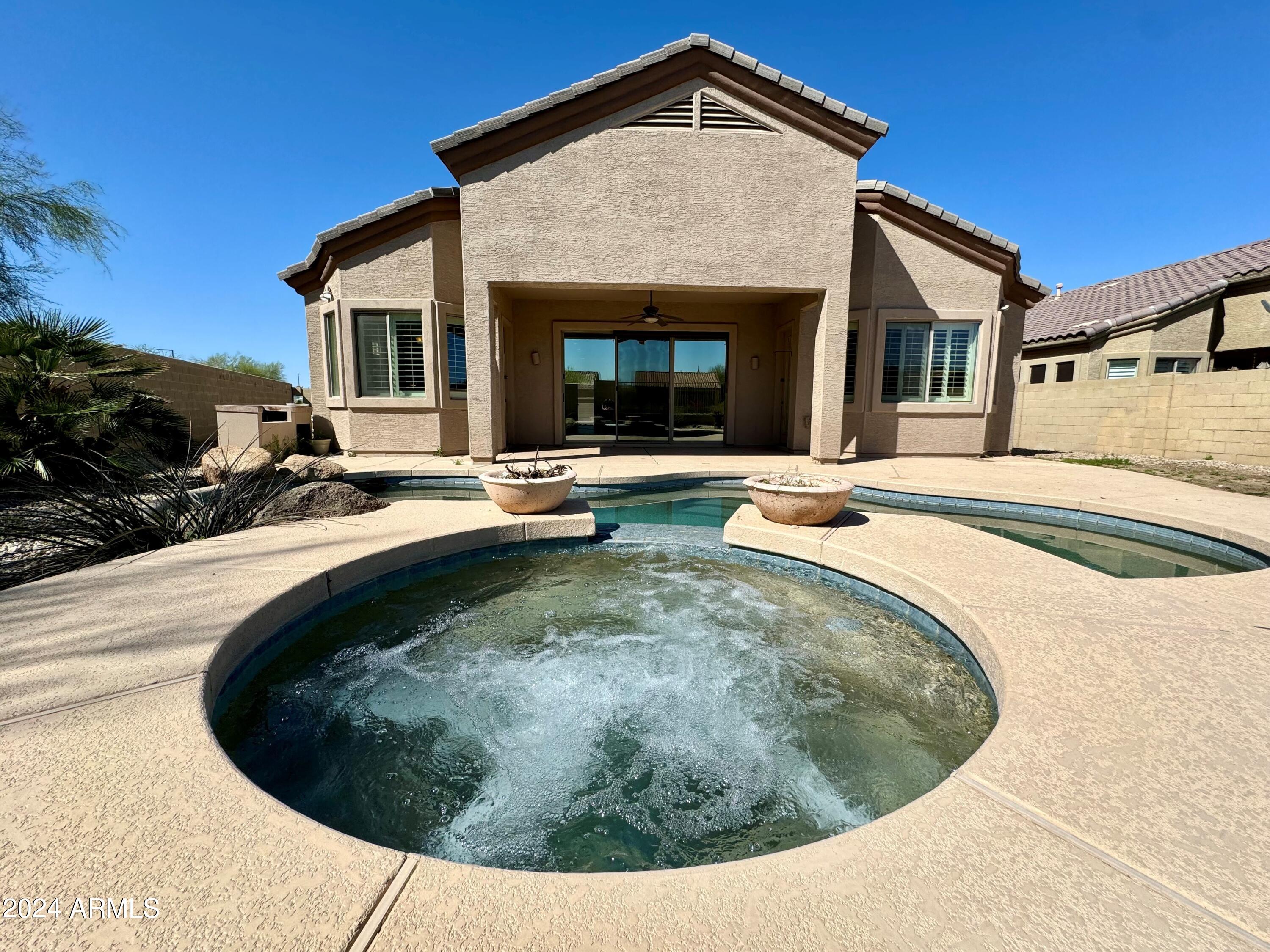 18426 West Piedmont Road Goodyear, AZ 85338 - Photo 2 of 25 a view of outdoor space with swimming pool