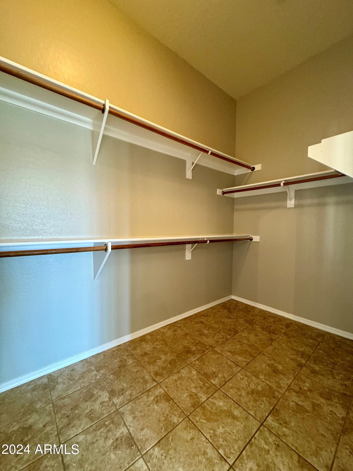 18426 West Piedmont Road Goodyear, AZ 85338 - Photo 23 of 25 a view of a room with wooden floor