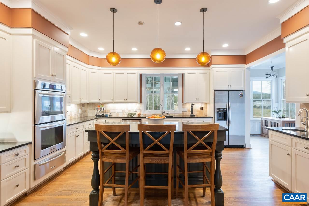 2340 Homestead Farm Road Free Union, VA 22940 - Photo 14 of 47 a kitchen with lots of counter space and chairs