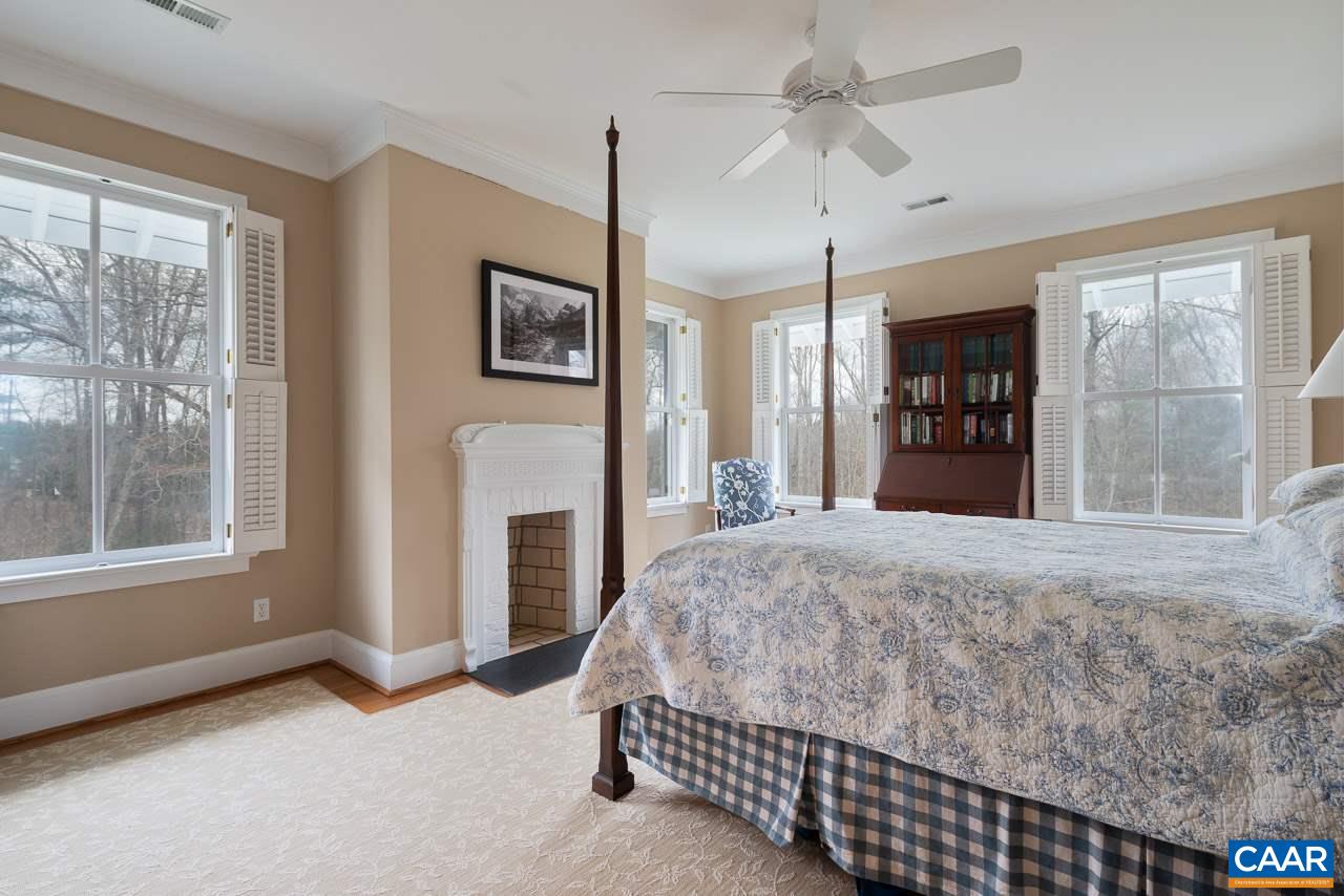 2340 Homestead Farm Road Free Union, VA 22940 - Photo 24 of 47 a spacious bedroom with a bed and a large window