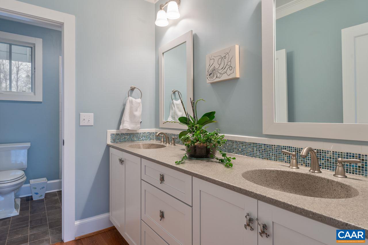 2340 Homestead Farm Road Free Union, VA 22940 - Photo 28 of 47 a bathroom with a granite countertop sink a toilet and a mirror