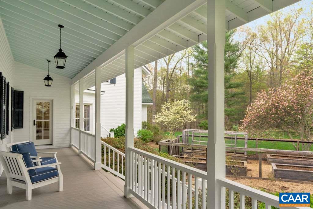 2340 Homestead Farm Road Free Union, VA 22940 - Photo 39 of 47 a view of a porch with furniture and a yard