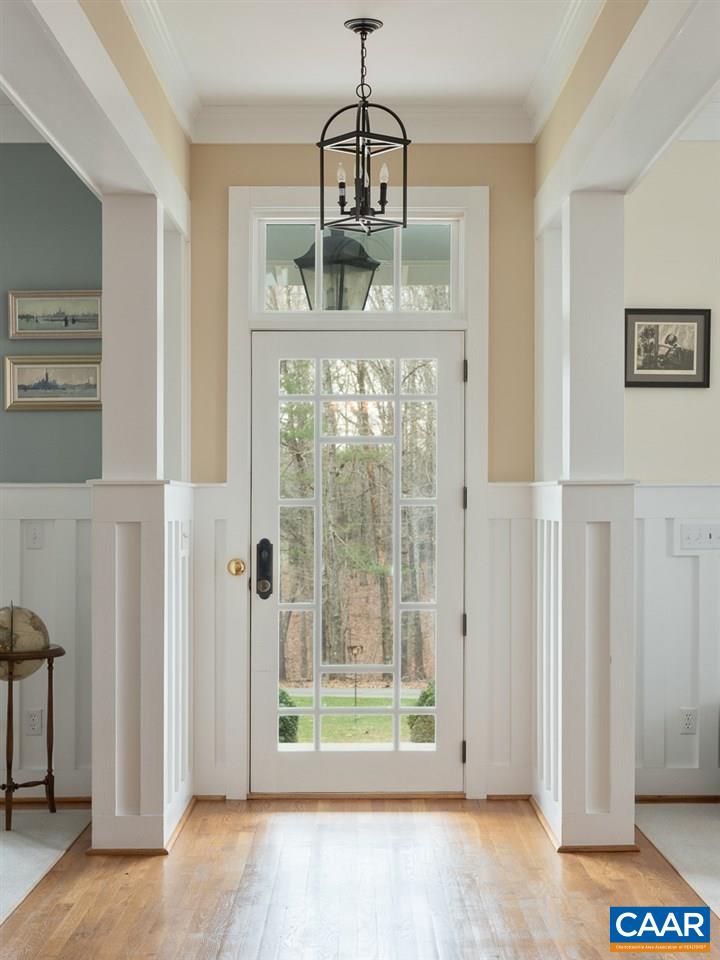 2340 Homestead Farm Road Free Union, VA 22940 - Photo 7 of 47 a view of a hallway with wooden floor and chandelier