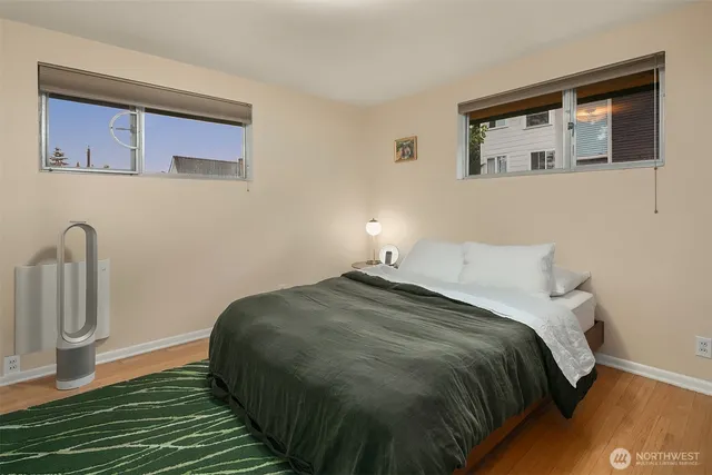 a bedroom with a bed and a mirror