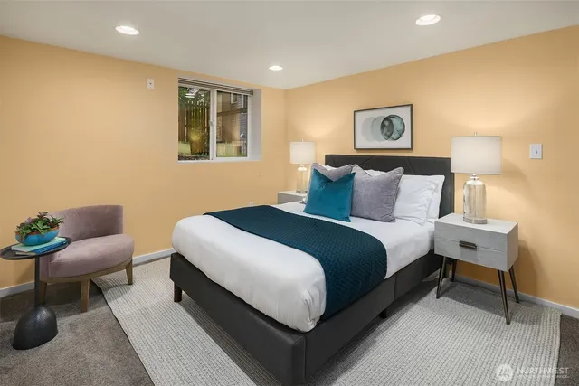 a bedroom with a bed and a couch