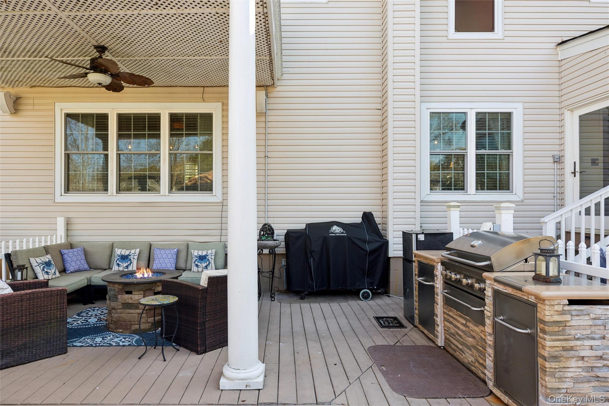 5045 Main Bayview Road Southold, NY 11971 - Photo 20 of 30 a view of a patio with table and chairs