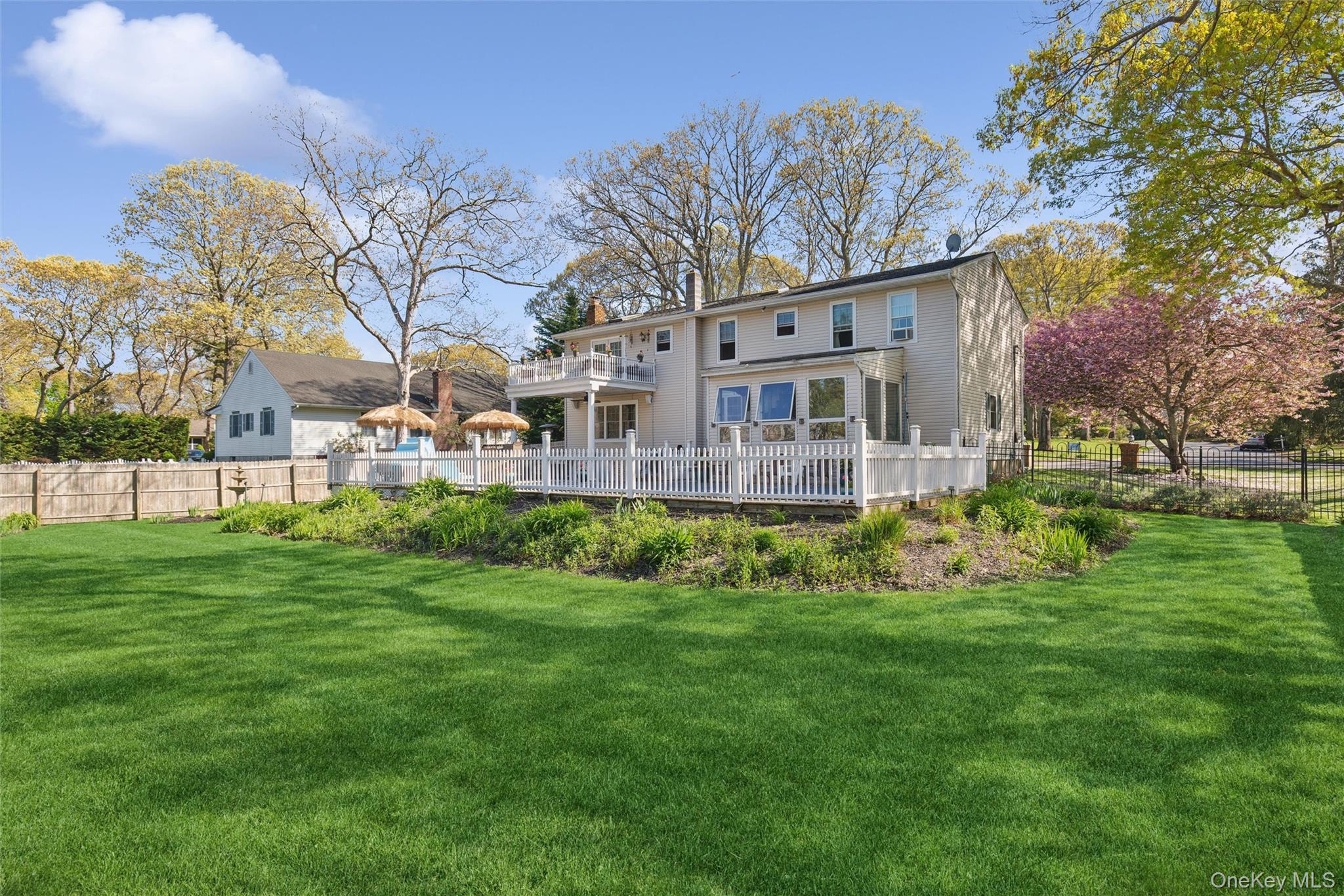5045 Main Bayview Road Southold, NY 11971 - Photo 21 of 30 a view of a house with a yard