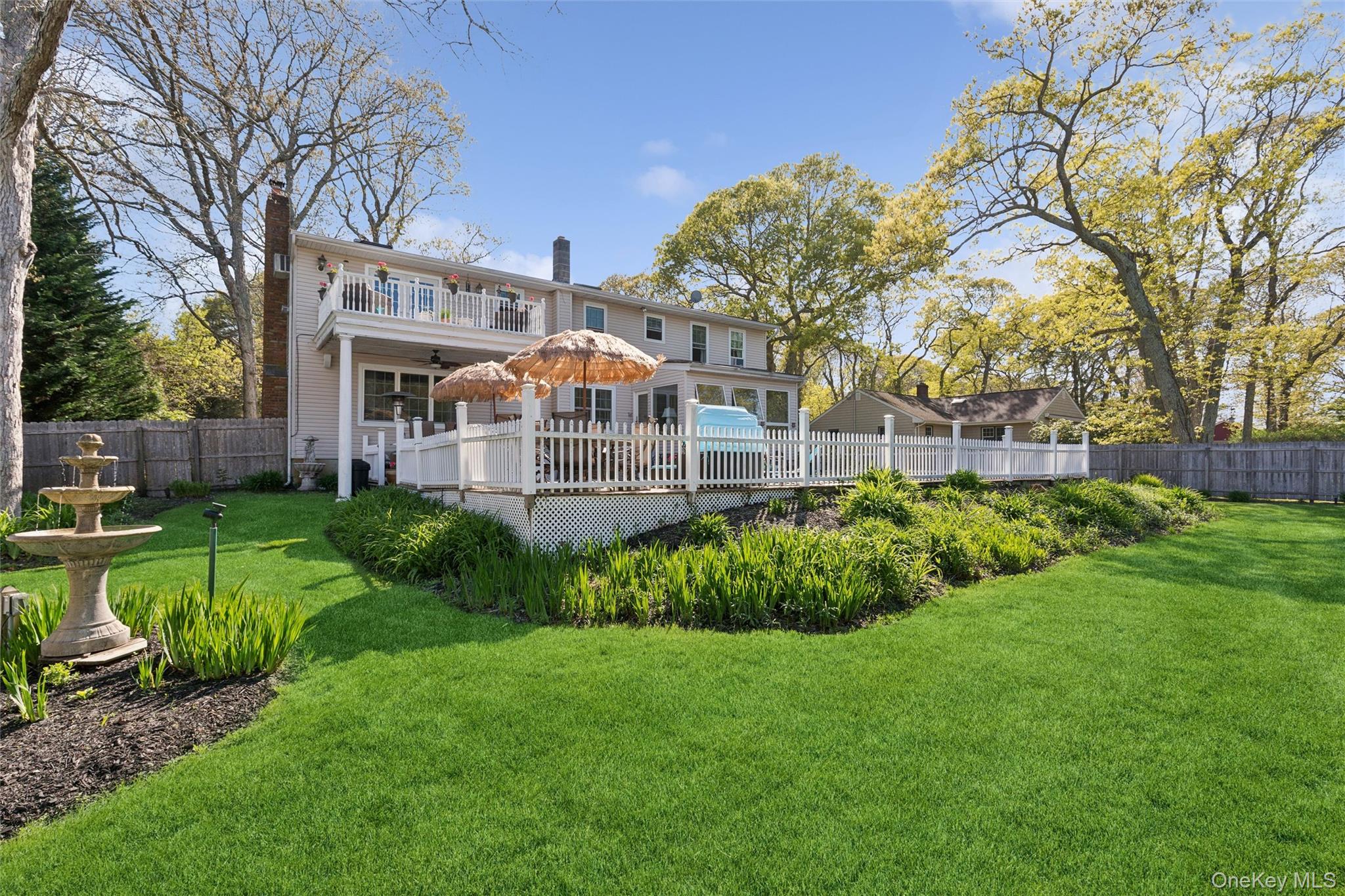 5045 Main Bayview Road Southold, NY 11971 - Photo 23 of 30 a front view of a house with garden