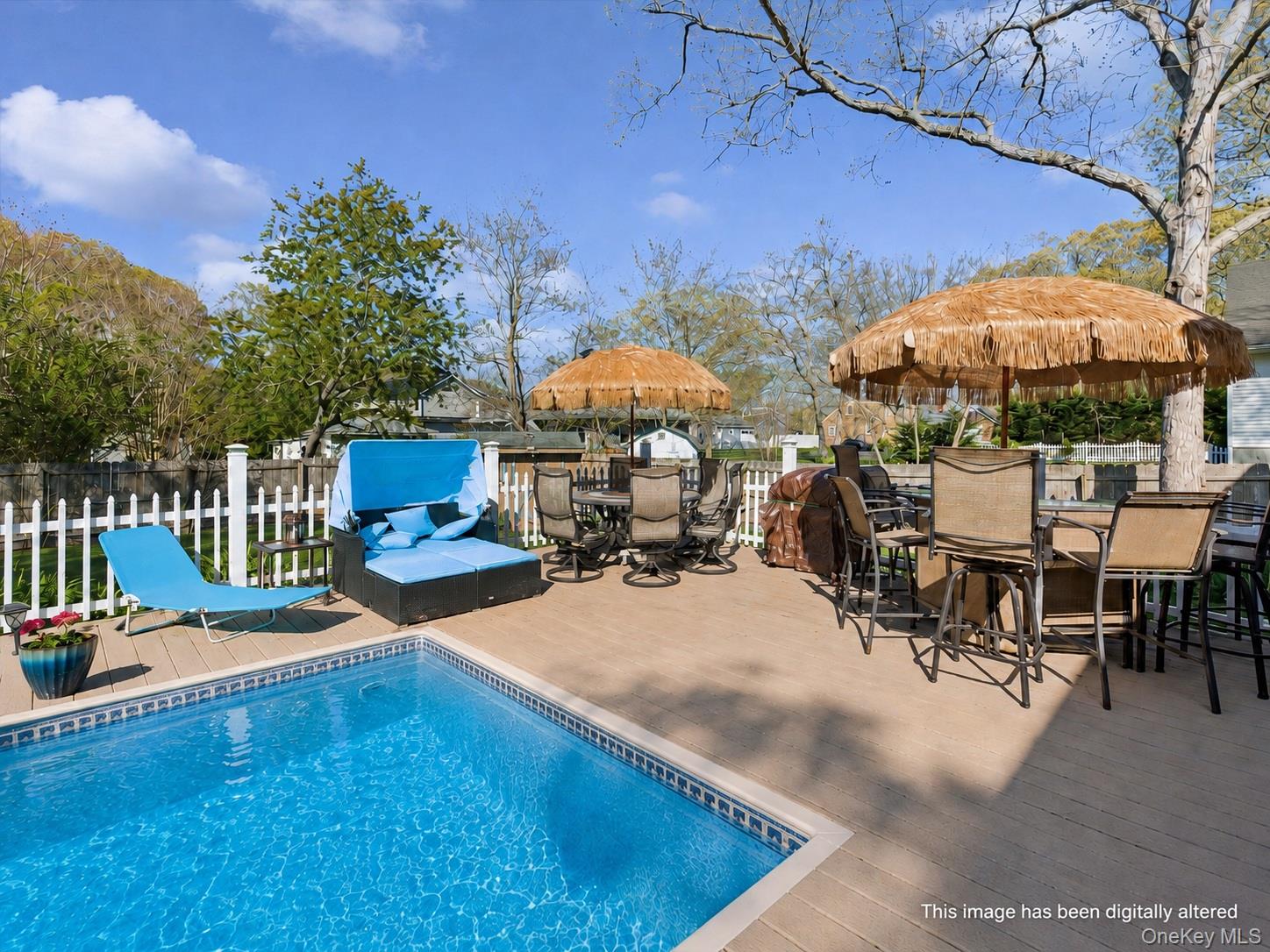 5045 Main Bayview Road Southold, NY 11971 - Photo 26 of 30 a view of a swimming pool with outdoor seating
