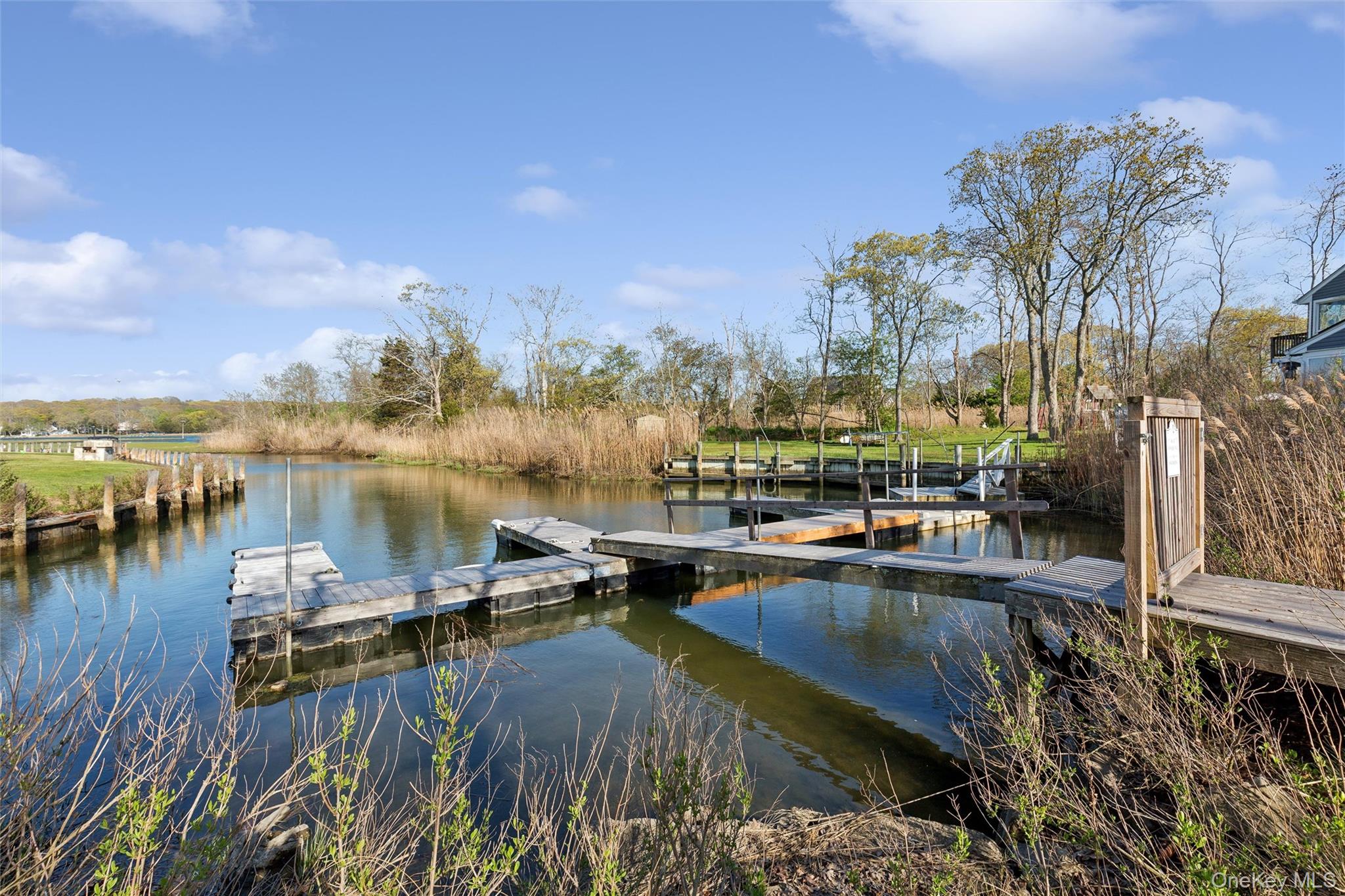 5045 Main Bayview Road Southold, NY 11971 - Photo 27 of 30 a view of a lake with a house
