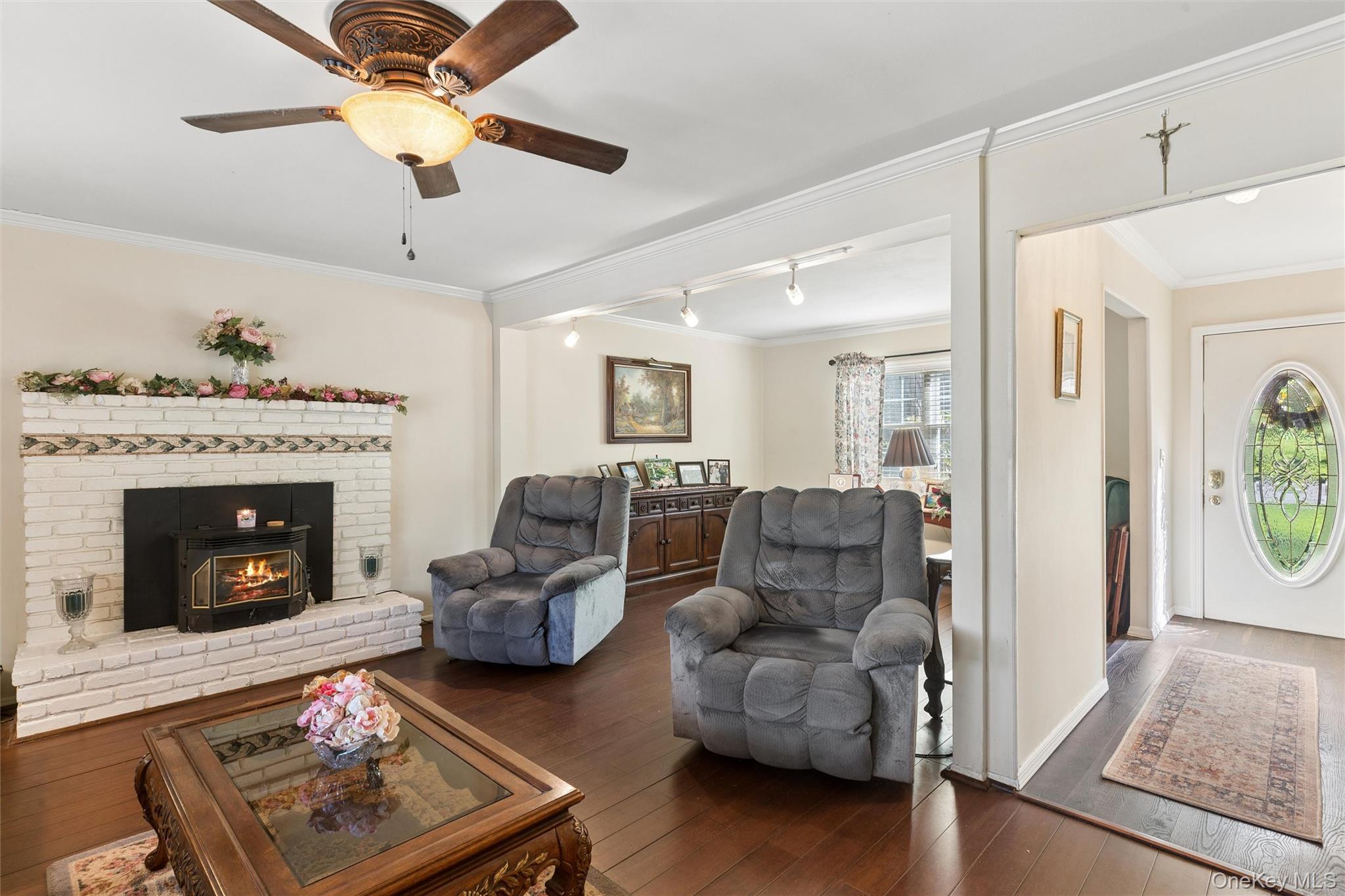 5045 Main Bayview Road Southold, NY 11971 - Photo 5 of 30 a living room with furniture and a fireplace