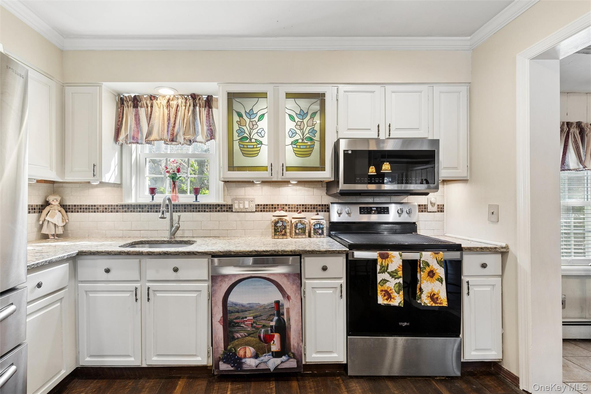 5045 Main Bayview Road Southold, NY 11971 - Photo 6 of 30 a kitchen with stainless steel appliances kitchen island granite countertop a stove a sink and a microwave