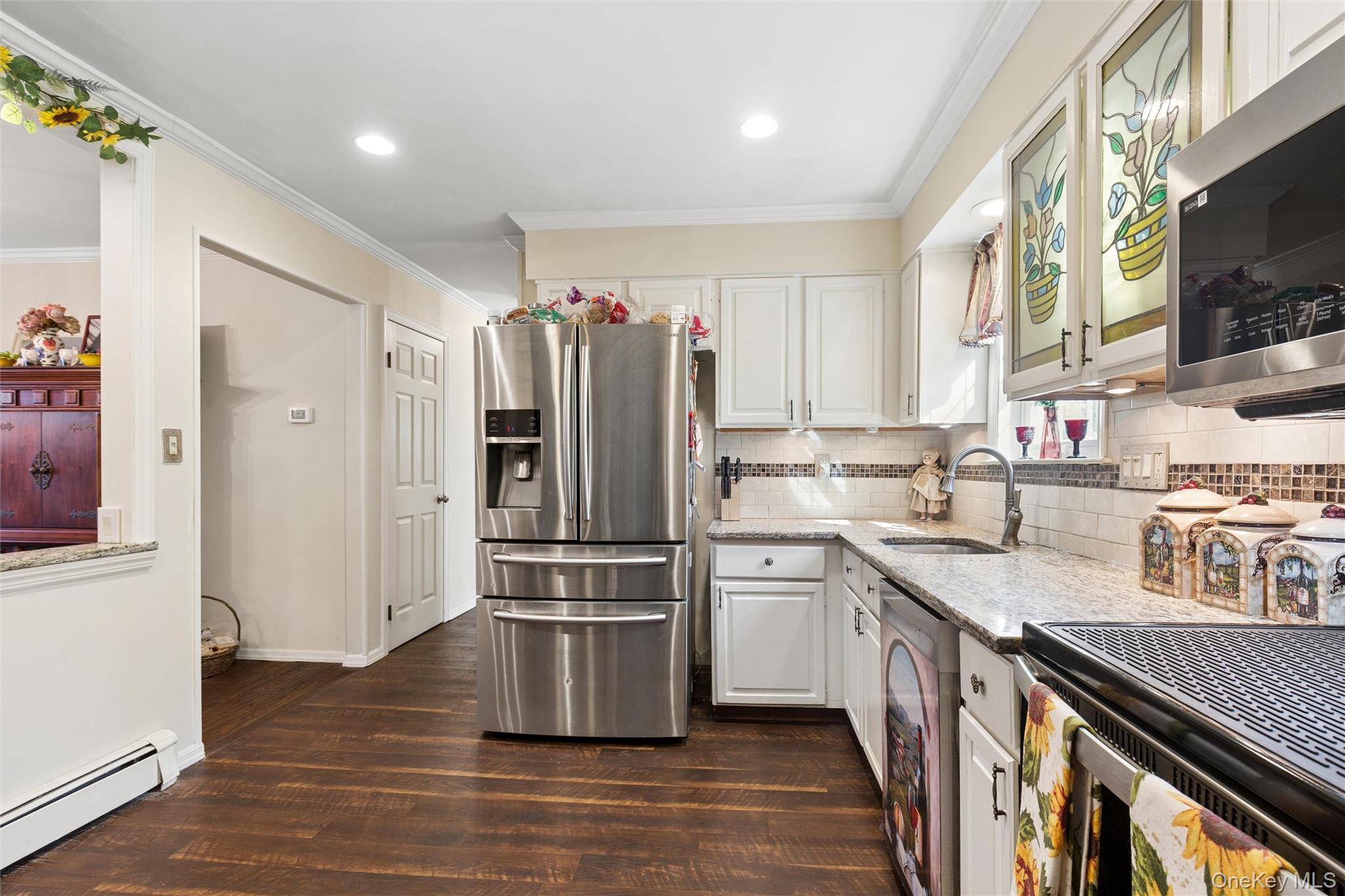 5045 Main Bayview Road Southold, NY 11971 - Photo 7 of 30 a kitchen with stainless steel appliances granite countertop a refrigerator stove and sink