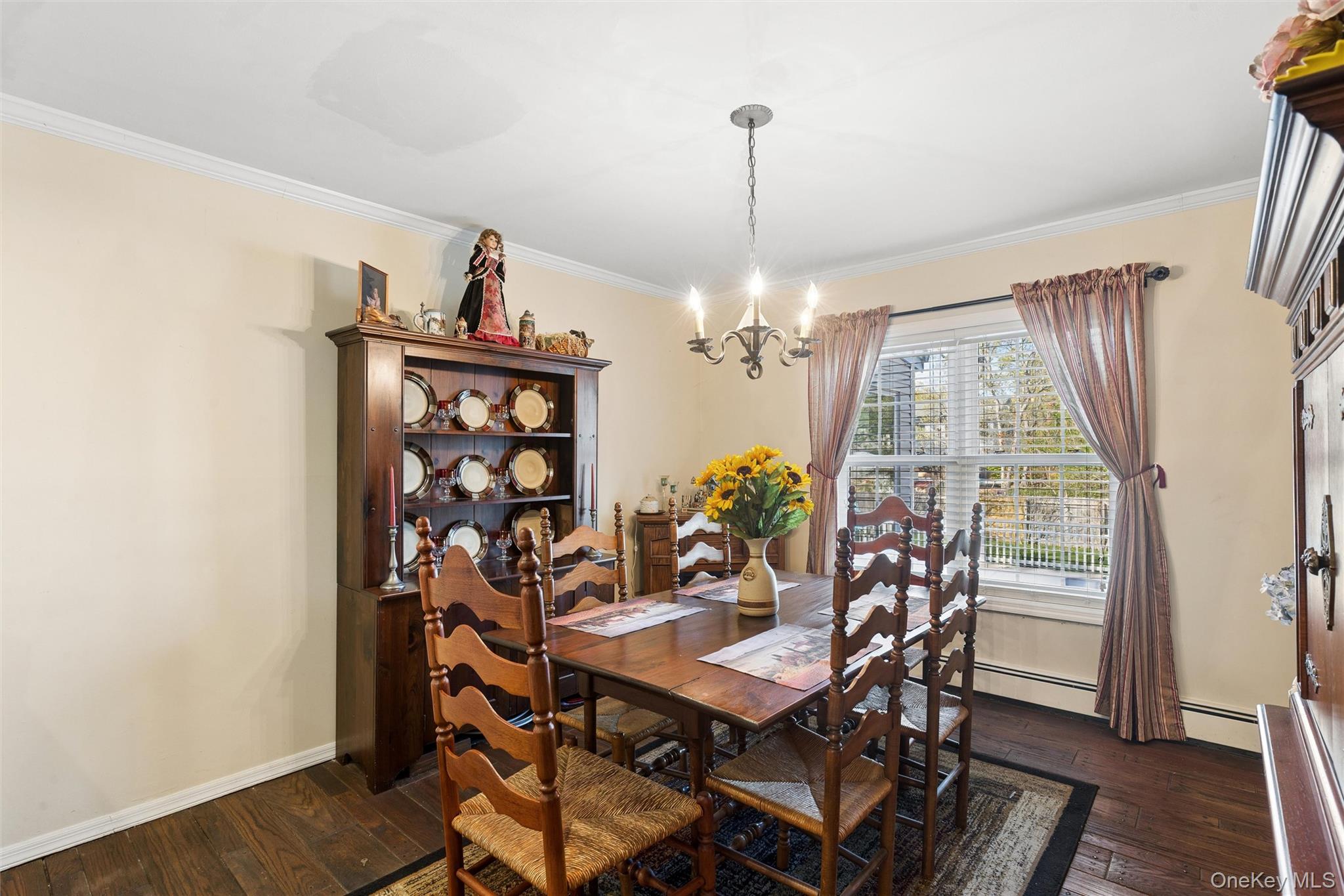 5045 Main Bayview Road Southold, NY 11971 - Photo 9 of 30 a view of a dining room with furniture and wooden floor