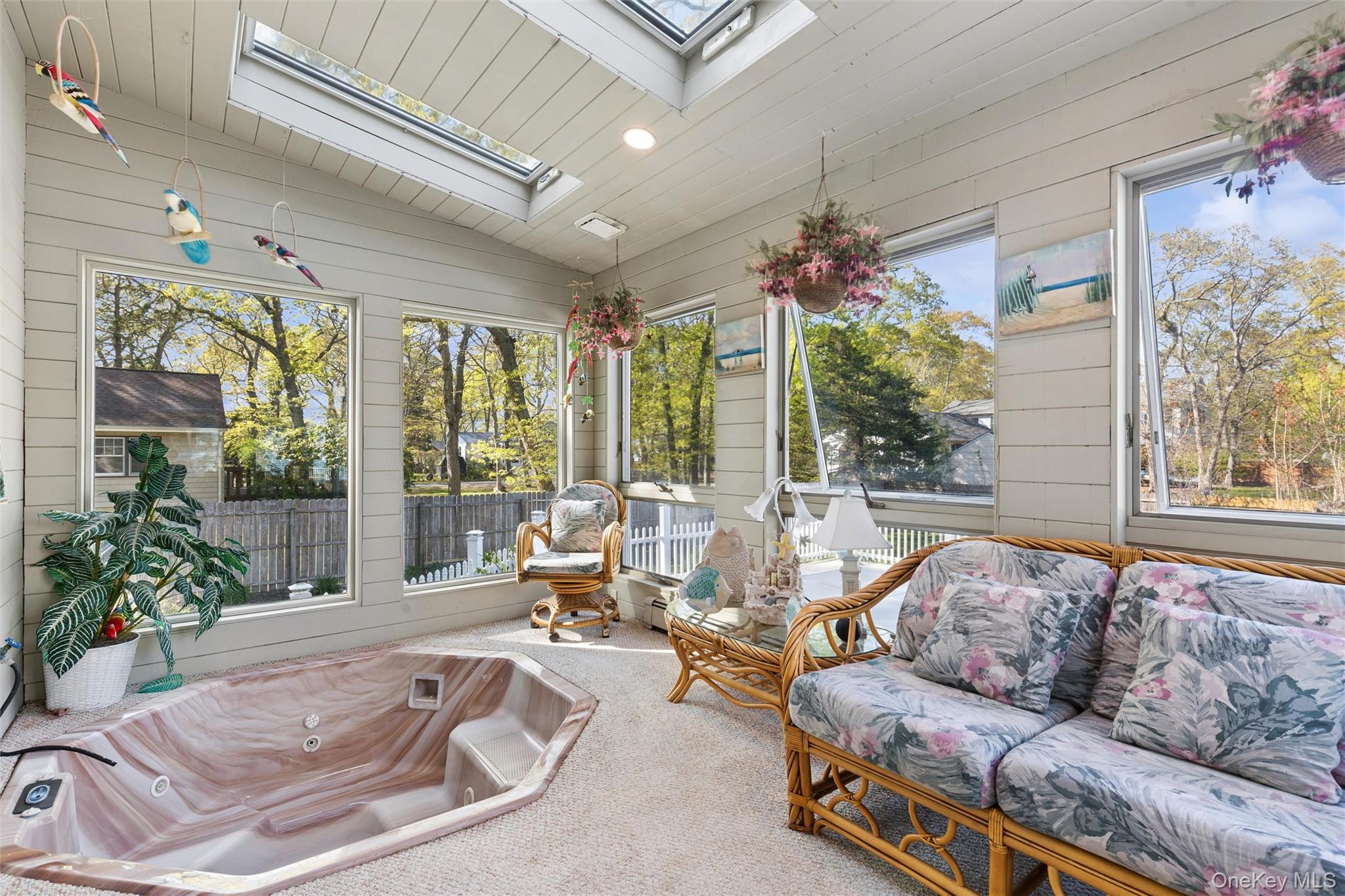 5045 Main Bayview Road Southold, NY 11971 - Photo 10 of 30 a living room with furniture and a large window