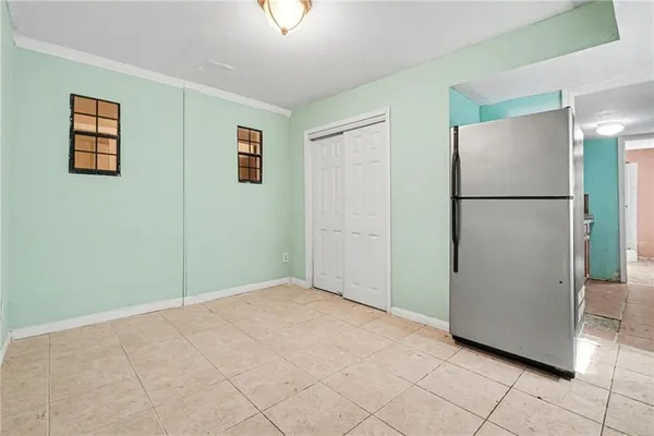 an empty room with closet area