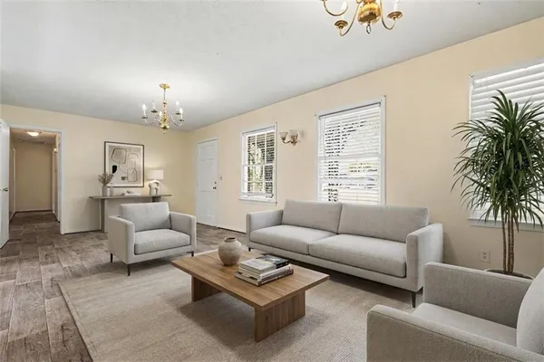 a living room with furniture and a large window