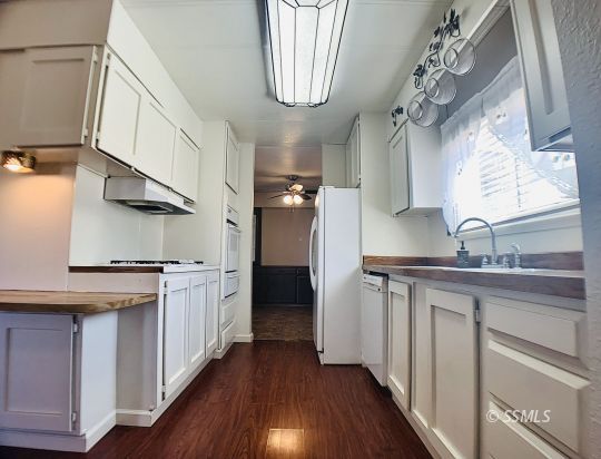 1370 Alpine Way Ridgecrest, CA 93555 - Photo 29 of 31 a kitchen with stainless steel appliances granite countertop a sink and a stove