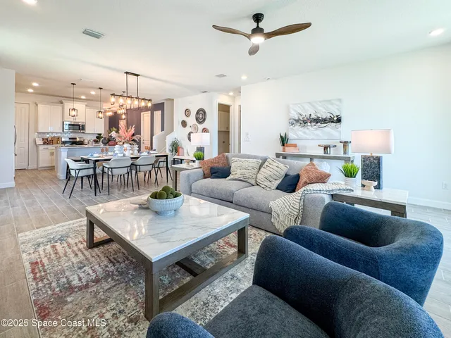 a living room with furniture and a table