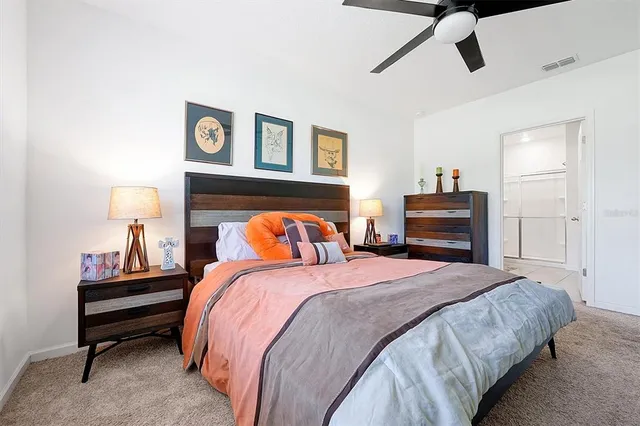 a bedroom with a bed and dresser