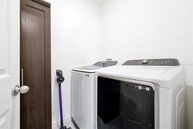 a view of a chairs and table in the garden