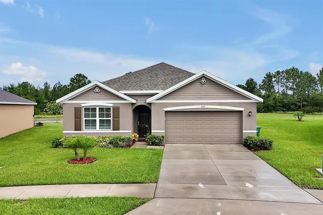 an aerial view of residential houses with outdoor space and swimming pool
