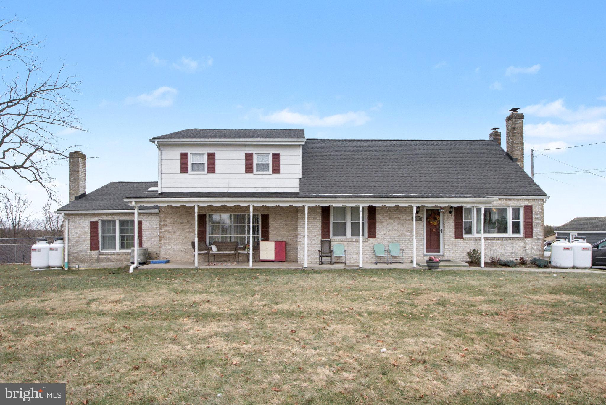 1310 Goldenville Road Gettysburg, PA 17325 - Photo 1 of 29 a front view of a house with a yard