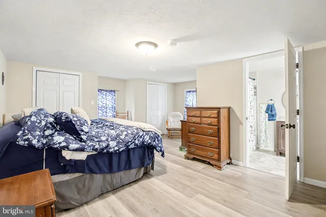 a bedroom with a bed and furniture