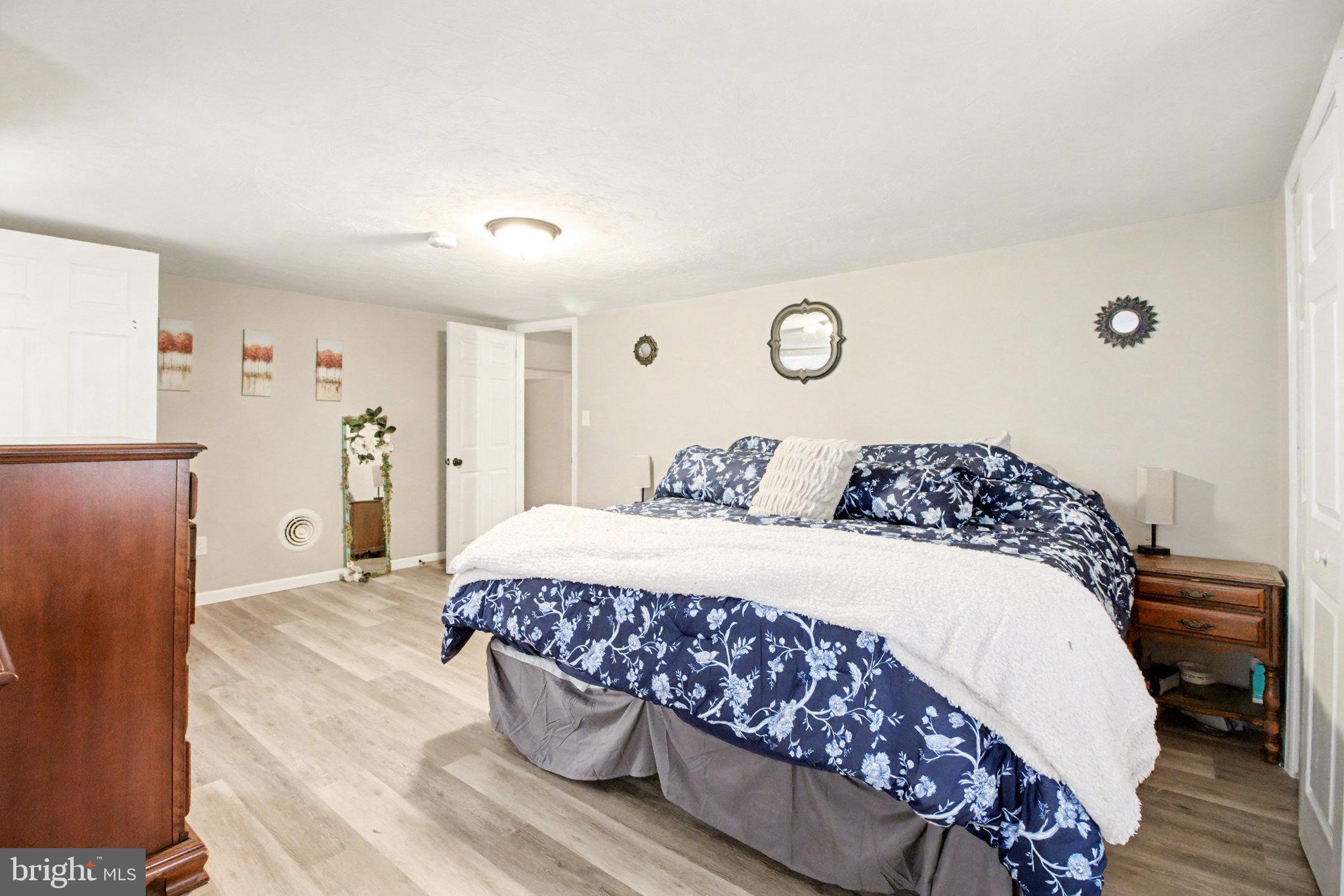 1310 Goldenville Road Gettysburg, PA 17325 - Photo 16 of 29 a bedroom with a bed and a refrigerator