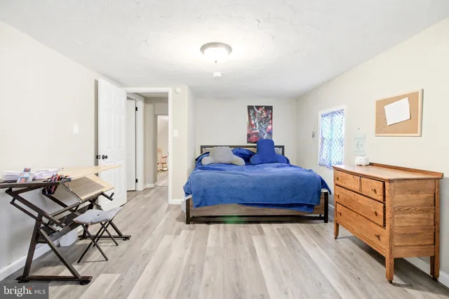 a bedroom with a bed and furniture