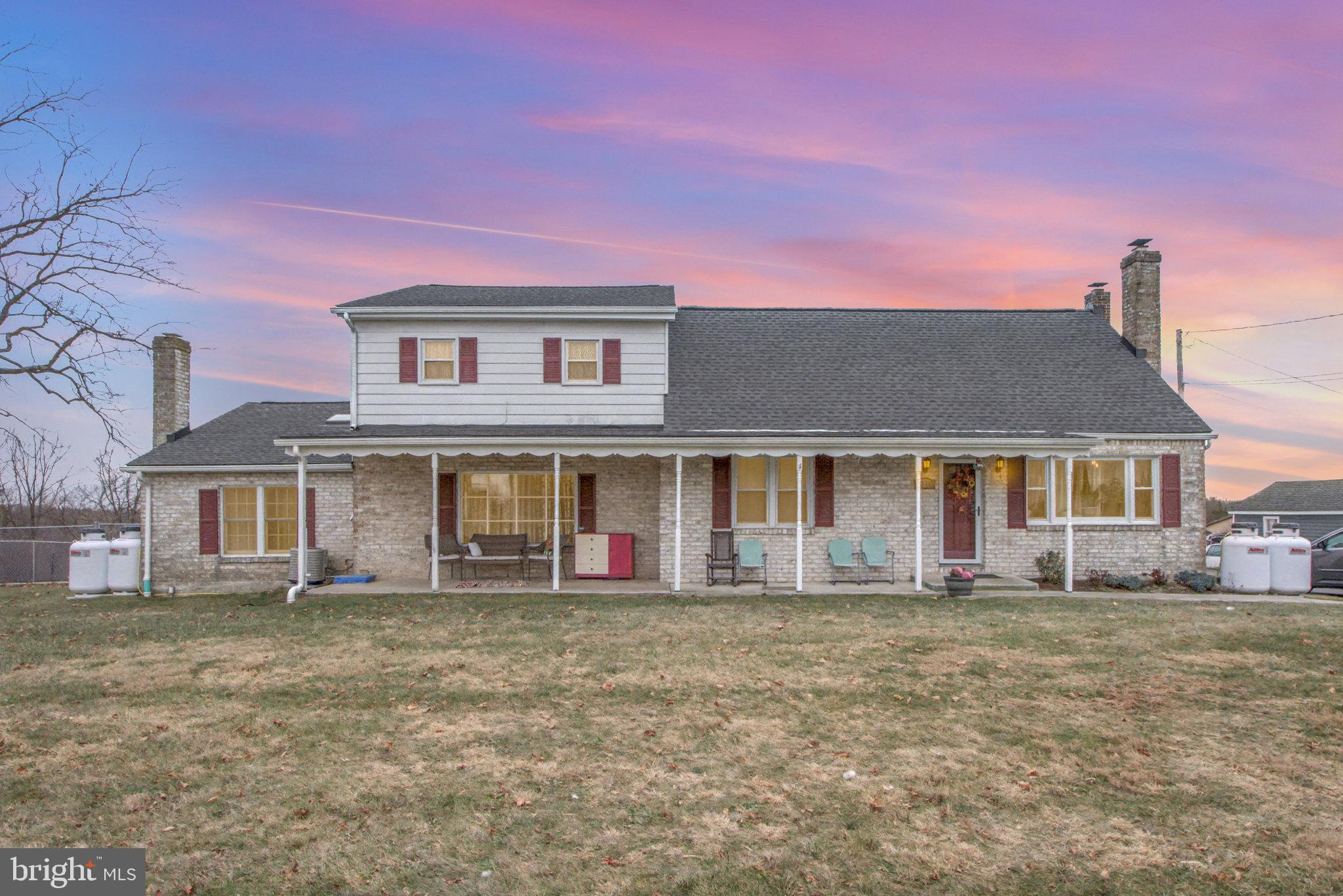 1310 Goldenville Road Gettysburg, PA 17325 - Photo 27 of 29 front view of a house with a yard