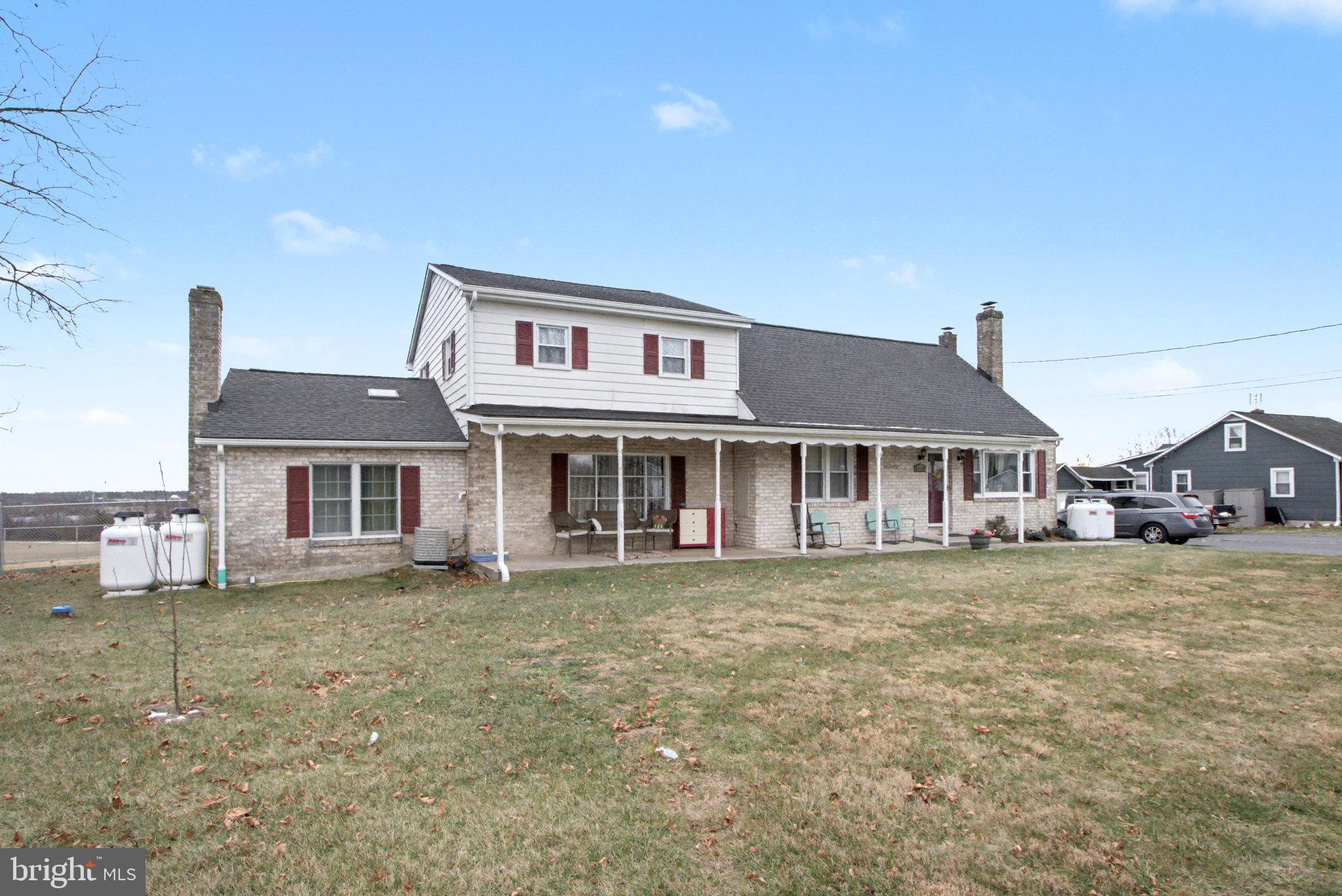 1310 Goldenville Road Gettysburg, PA 17325 - Photo 3 of 29 a front view of a house with a garden
