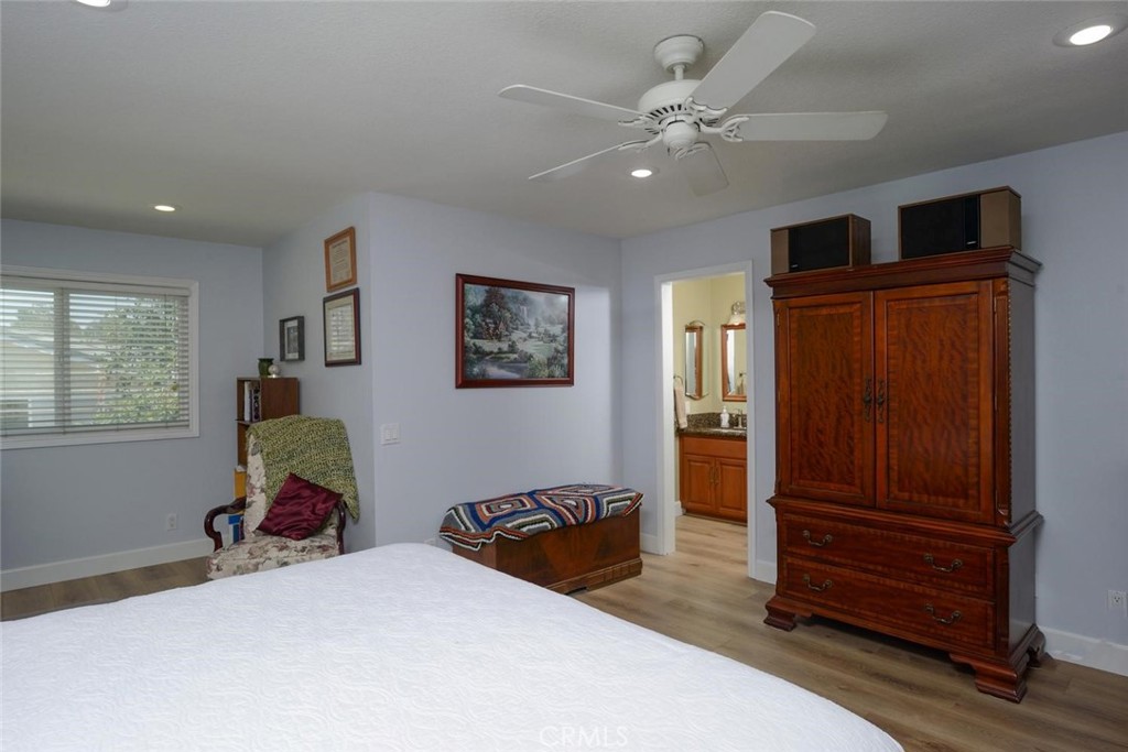 10424 Cartilla Court Rancho Cucamonga, CA 91737 - Photo 15 of 36 a bedroom with a bed and wooden floor