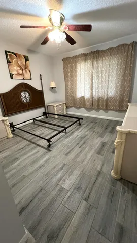 a view of a room with gym equipment and a window