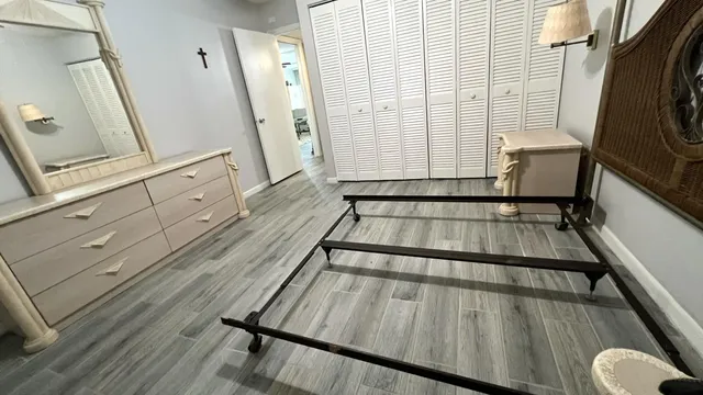 a living room with hard wood flooring and white walls