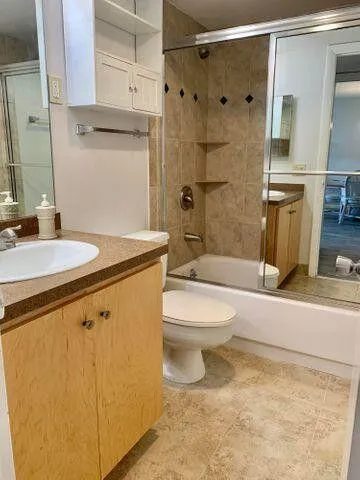 a view of a hallway view with wooden floor and staircase