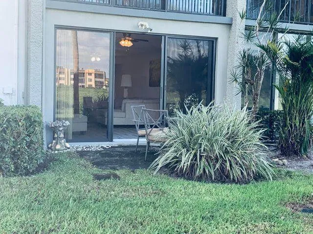 a view of a swimming pool with a lounge chair