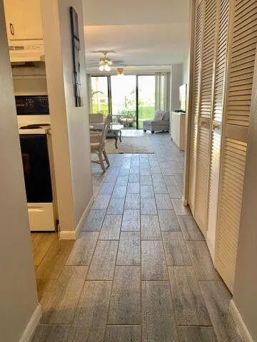 a view of a living room with windows