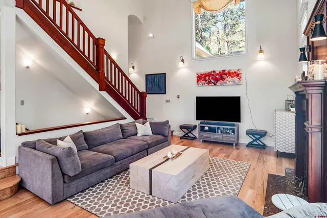 a balcony with furniture and a potted plant