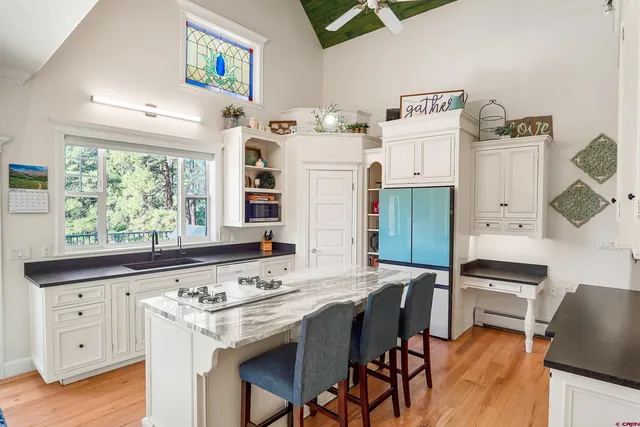 a view of kitchen island with furniture and wooden floor