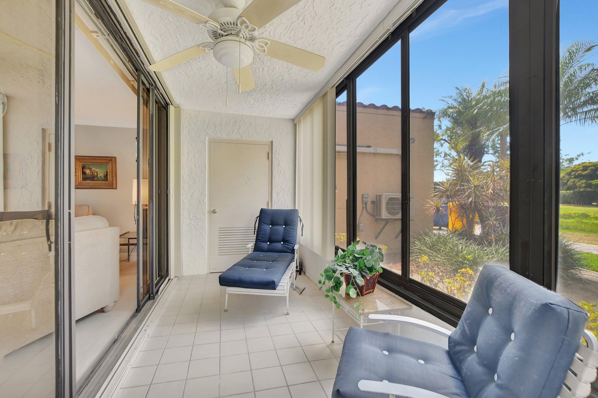 7194 Promenade Drive, Unit 102 Boca Raton, FL 33433 - Photo 36 of 56 a living room with furniture and a potted plant