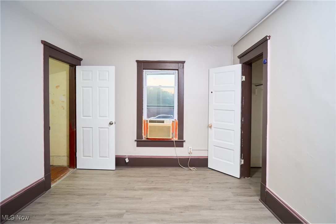 5432 State Road Parma, OH 44134 - Photo 41 of 47 Unfurnished bedroom with light wood-type flooring and cooling unit