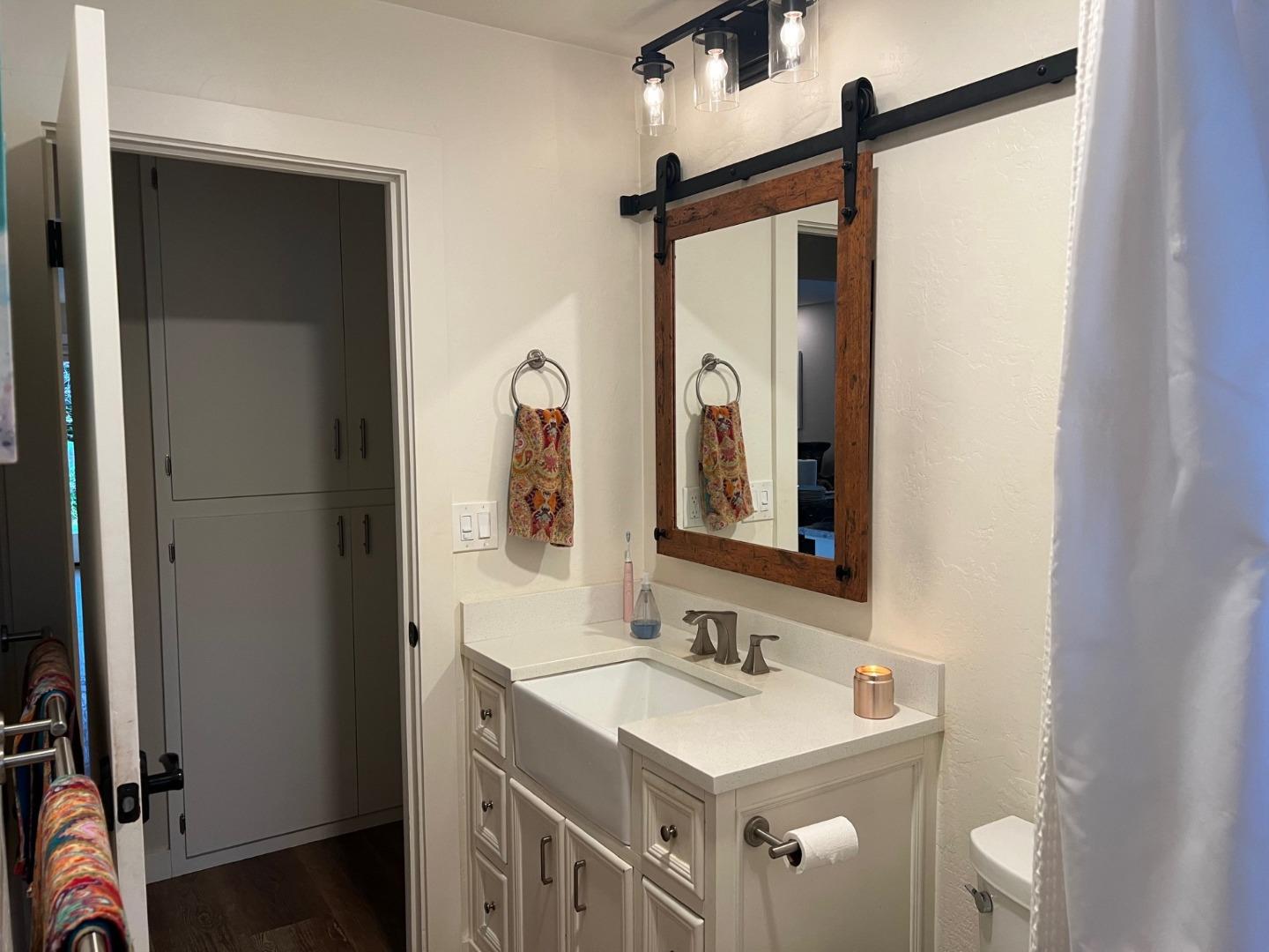 3247 Soquel San Jose Road Soquel, CA 95073 - Photo 11 of 34 a bathroom with a sink a mirror and a shower