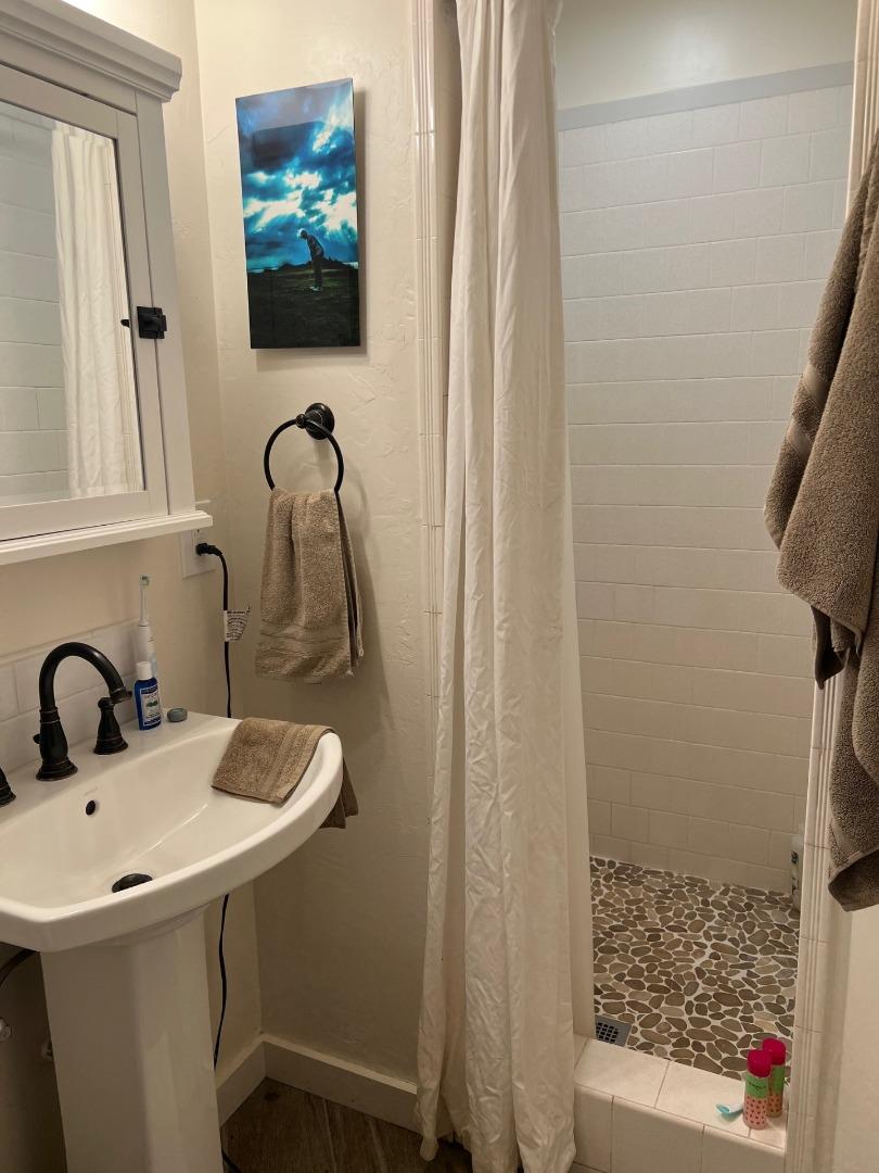 3247 Soquel San Jose Road Soquel, CA 95073 - Photo 32 of 34 a bathroom with a sink and a mirror