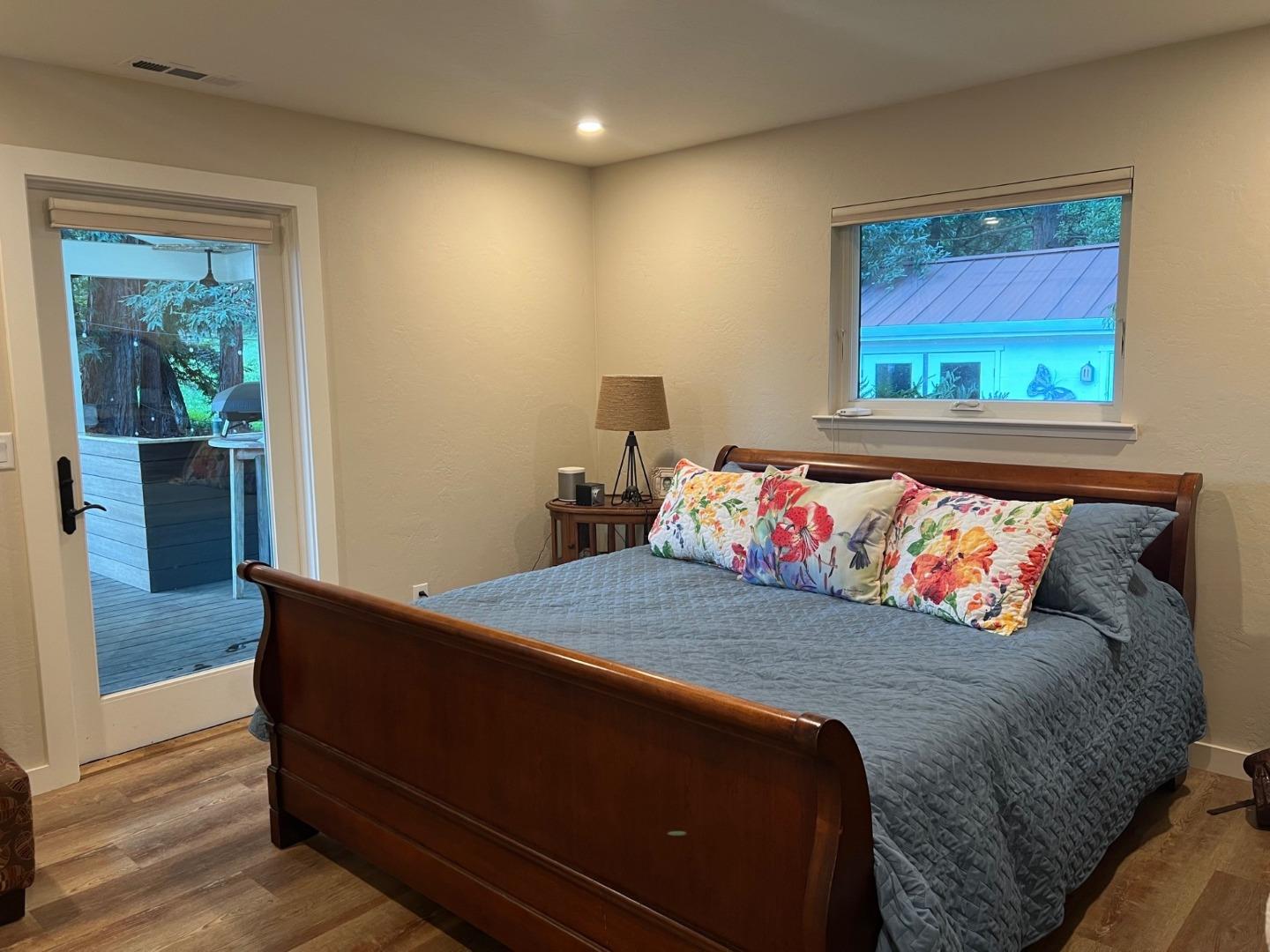 3247 Soquel San Jose Road Soquel, CA 95073 - Photo 8 of 34 a bed sitting in a bedroom next to a window